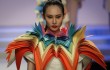 A model presents a creation at the BIFT Graduates Show 2012 held during China Fashion Week in Beijing, China, Thursday, March 29, 2012. (AP Photo/ Vincent Thian)